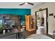 A brightly lit modern bedroom featuring a dark desk and a personal sauna at 12219 Steppingstone Blvd, Tampa, FL 33635
