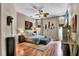 A naturally lit bedroom featuring African-themed decor and hardwood floors at 12219 Steppingstone Blvd, Tampa, FL 33635