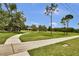 Scenic community park with walking paths, green spaces, and a covered picnic area, great for outdoor activities at 12219 Steppingstone Blvd, Tampa, FL 33635