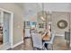 Open dining area with high ceilings and view of living room and patio at 12219 Steppingstone Blvd, Tampa, FL 33635