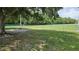Fenced community dog park with benches and mature trees for shade, providing a safe space for pets to play at 12219 Steppingstone Blvd, Tampa, FL 33635