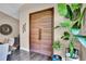 Elegant entryway featuring a striking wood double door and stylish decor at 12219 Steppingstone Blvd, Tampa, FL 33635