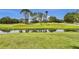 Golf course view of the serene community waterway at 12219 Steppingstone Blvd, Tampa, FL 33635