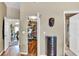 Hallway with doorways to a dining room, walk-in closet, and bathroom at 12219 Steppingstone Blvd, Tampa, FL 33635