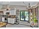 Well-equipped kitchen with stainless steel appliances, garden window and adjacent dining area at 12219 Steppingstone Blvd, Tampa, FL 33635