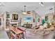 Inviting living room with stone fireplace, bar-style seating and large comfortable wrap-around sofa at 12219 Steppingstone Blvd, Tampa, FL 33635