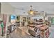 Spacious living room featuring open layout with dining area and modern furnishings at 12219 Steppingstone Blvd, Tampa, FL 33635