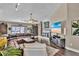 Open living area with dark wood floors, leather couches and fireplace at 12219 Steppingstone Blvd, Tampa, FL 33635