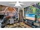 Office area featuring a gorilla mural, a lush jungle mural, and a ceiling fan at 12219 Steppingstone Blvd, Tampa, FL 33635