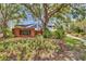 Inviting entrance to Glencliff Park with brick signage, landscaping, and mature trees at 12219 Steppingstone Blvd, Tampa, FL 33635