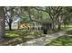 Shaded picnic area with tables and playground in a community park, ideal for Gathering gatherings and outdoor dining at 12219 Steppingstone Blvd, Tampa, FL 33635