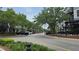 Picturesque street view lined with trees, restaurants, and shops offering a vibrant community atmosphere at 12219 Steppingstone Blvd, Tampa, FL 33635