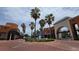 Beautiful town center with palm trees, a water feature, and various shops and restaurants nearby at 12219 Steppingstone Blvd, Tampa, FL 33635