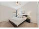 A neutral bedroom featuring a plush bed with decorative pillows and a full closet at 12229 Coldstream Ln, Tampa, FL 33626