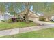 Charming single-story home featuring a well-manicured lawn and a cozy two-car garage at 12229 Coldstream Ln, Tampa, FL 33626