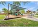 Community playground featuring multiple slides, climbing structures, and a picnic area, perfect for Gathering fun at 12229 Coldstream Ln, Tampa, FL 33626