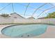 Inviting in-ground pool with a screened enclosure offering privacy and enjoyment in a residential neighborhood at 12229 Coldstream Ln, Tampa, FL 33626