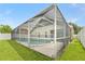 Captivating screened-in pool showcasing an exceptional vantage point from the well-maintained backyard at 12229 Coldstream Ln, Tampa, FL 33626