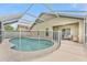 Screened-in pool with safety fence, covered patio, and ample deck space for entertaining at 12229 Coldstream Ln, Tampa, FL 33626