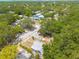 Aerial view shows the residential neighborhood and fenced yard at 1235 Bass Blvd, Dunedin, FL 34698