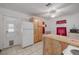 Functional kitchen with wood cabinets, island, and modern appliances at 1235 Bass Blvd, Dunedin, FL 34698