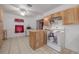 Functional kitchen with wood cabinets, island, and ample counter space at 1235 Bass Blvd, Dunedin, FL 34698