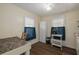 Cozy kitchen with wood floors, white appliances, and two windows letting in natural light at 1235 Bass Blvd, Dunedin, FL 34698