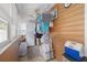 Bright laundry area featuring a washer/dryer unit and ample storage space and ceiling fan at 1235 Bass Blvd, Dunedin, FL 34698