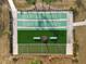 Aerial view of a community shuffleboard court with picnic tables and benches for relaxation at 13127 Topflite Ct, Hudson, FL 34669