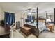 Bedroom features a four poster bed, ceiling fan, and vanity at 13127 Topflite Ct, Hudson, FL 34669