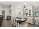 Dining area with chandelier with easy access to the living room and hallway at 13127 Topflite Ct, Hudson, FL 34669