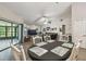Dining area has a large dining table, china cabinet, and sliding glass doors at 13127 Topflite Ct, Hudson, FL 34669