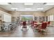 The community's game room features a ping pong table, multiple tables, and tons of bookshelves at 13127 Topflite Ct, Hudson, FL 34669