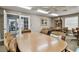 Inviting clubhouse game room featuring comfortable chairs and various tables for entertainment at 13127 Topflite Ct, Hudson, FL 34669