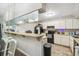 Functional kitchen with a breakfast bar at 13127 Topflite Ct, Hudson, FL 34669
