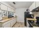 Compact kitchen with essential appliances at 13127 Topflite Ct, Hudson, FL 34669