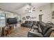Bright living room boasts high ceilings, neutral walls, and hardwood flooring at 13127 Topflite Ct, Hudson, FL 34669