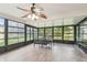Sunroom with wall-to-wall windows offering abundant natural light at 13127 Topflite Ct, Hudson, FL 34669