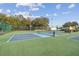 Community pickleball courts featuring well-maintained surfaces, lighting, and lush greenery for an active lifestyle at 13127 Topflite Ct, Hudson, FL 34669
