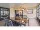 Well-lit sunroom with tile floors and ceiling fan, perfect for relaxing and enjoying the view at 13127 Topflite Ct, Hudson, FL 34669