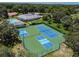 Birds-eye view of tennis and pickleball courts highlighting the community's commitment to recreation and leisure at 13127 Topflite Ct, Hudson, FL 34669
