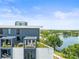 Modern rooftop terrace with turf and lounge furniture overlooking scenic lake views at 132 Mirror Lake N Dr # 501, St Petersburg, FL 33701
