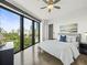 Bedroom featuring large windows with city views, wood floors, and neutral decor at 132 Mirror Lake N Dr # 501, St Petersburg, FL 33701