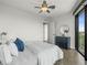Bright bedroom with dark wood floors, large windows, and blue accents at 132 Mirror Lake N Dr # 501, St Petersburg, FL 33701