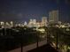 Night view of the cityscape, showcasing a vibrant skyline from a high-rise balcony at 132 Mirror Lake N Dr # 501, St Petersburg, FL 33701
