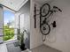 Condo entry featuring a mounted bicycle rack, a green plant, and a view of the cityscape at 132 Mirror Lake N Dr # 501, St Petersburg, FL 33701