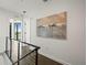 Upstairs hallway with wood floors and a large painting, overlooking the lake at 132 Mirror Lake N Dr # 501, St Petersburg, FL 33701