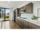 Kitchen featuring dark wood cabinets, stainless steel appliances, and quartz countertops at 132 Mirror Lake N Dr # 501, St Petersburg, FL 33701
