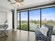Cozy living area with large windows, wood floors, and city views at 132 Mirror Lake N Dr # 501, St Petersburg, FL 33701