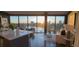 Bright living room with floor-to-ceiling windows and stunning water views at 132 Mirror Lake N Dr # 501, St Petersburg, FL 33701